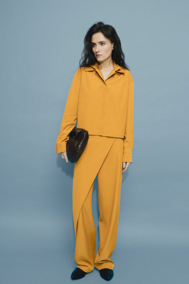 The woolen wrap wide trousers. Made of deadstock luxury fabrics
The woolen shirt with a double collar. Made of deadstock luxury fabrics
Magnetic fasteners, adjustable sleeves.
Easy to wear