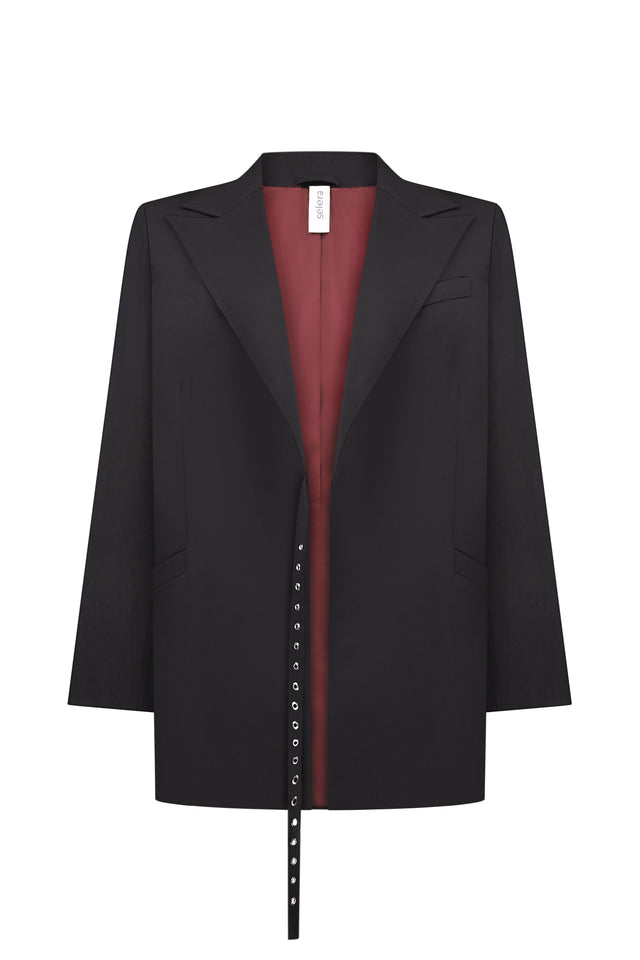 An oversized black woolen jacket 