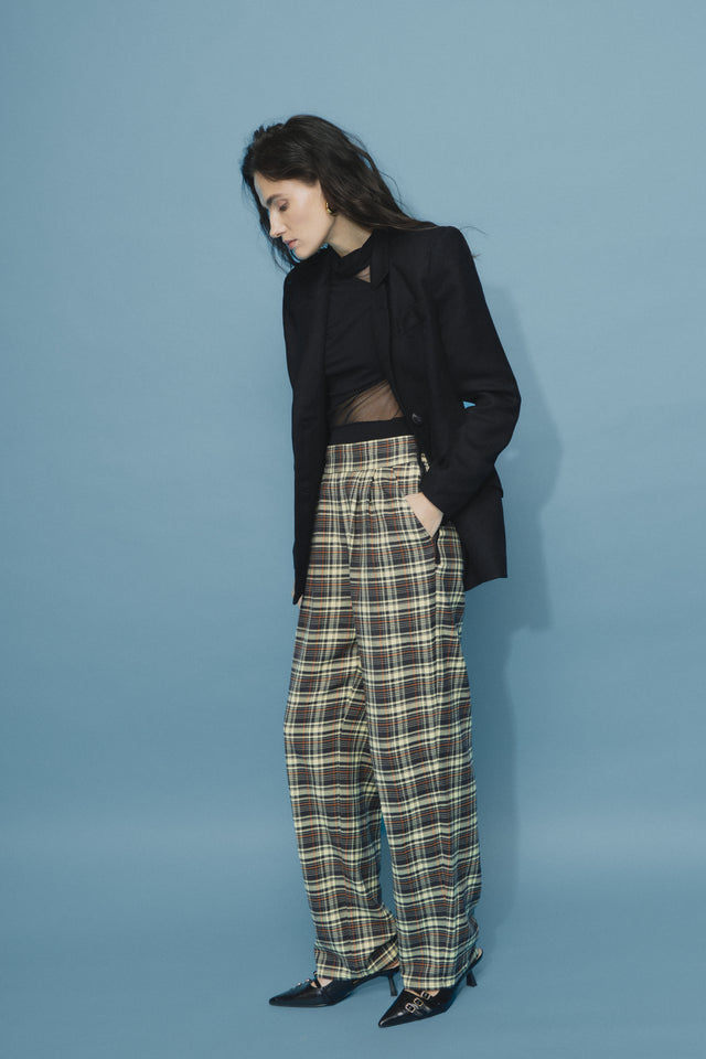 The woolen & cotton tartan trousers with zippers. Made of deadstock luxury fabrics