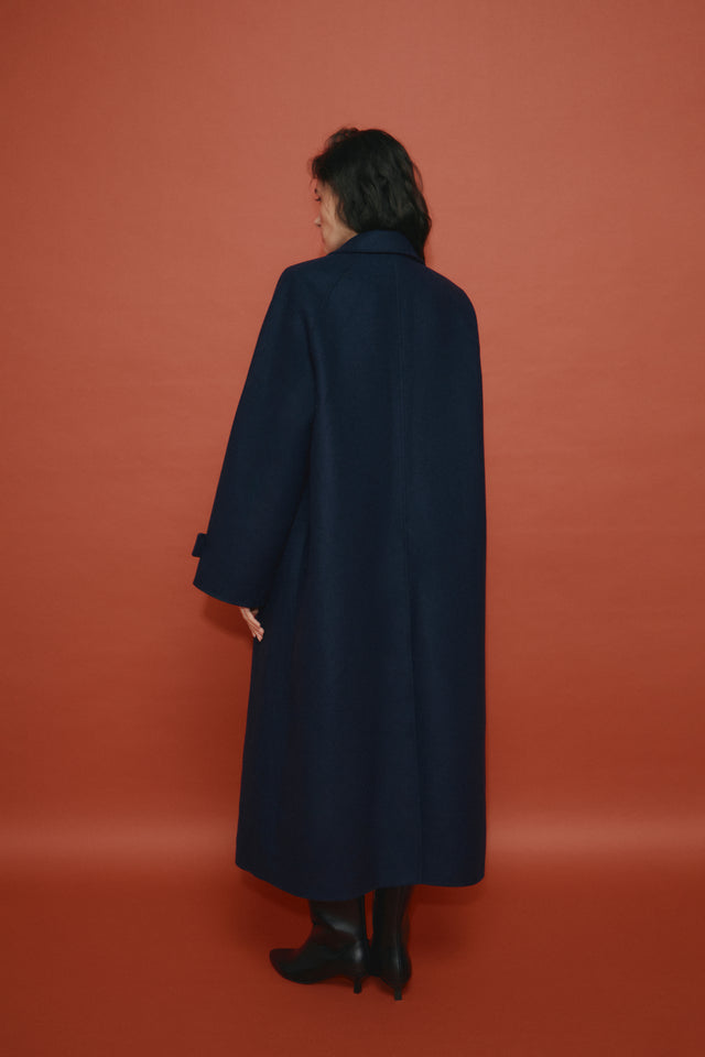 Oversized coat with belt. Made of luxury deadstock fabric